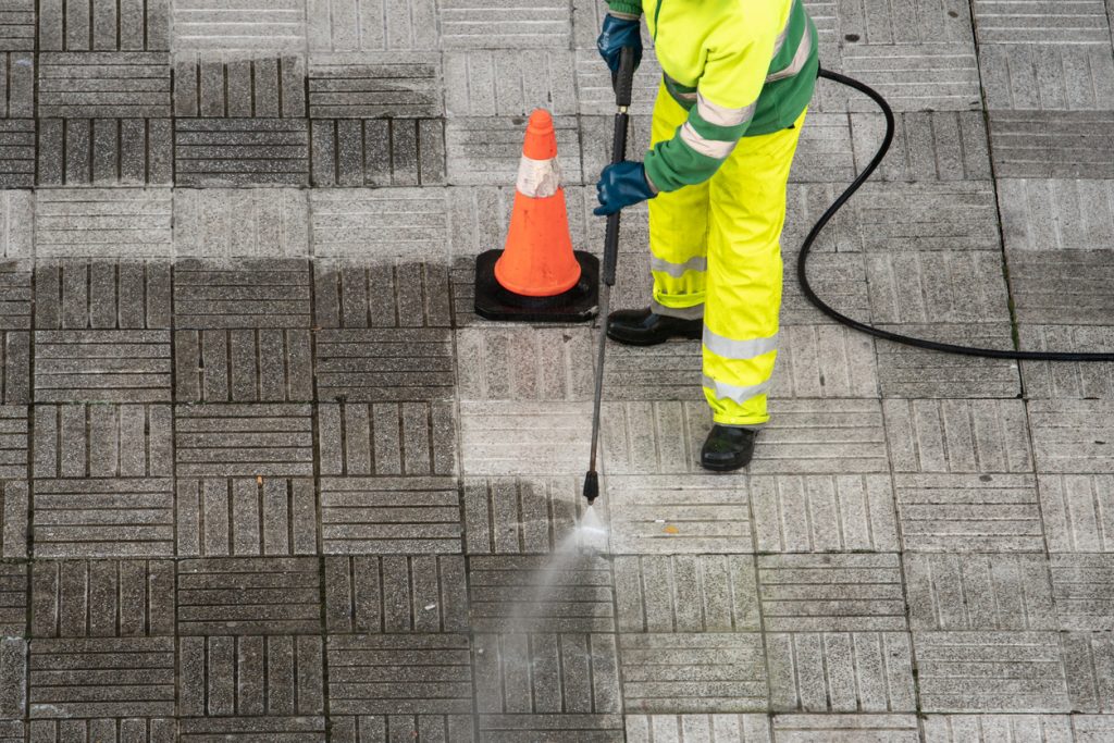 outdoor pressure washing cleaner on sidewalk